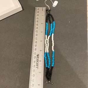 Black white and blue triple string bracelet